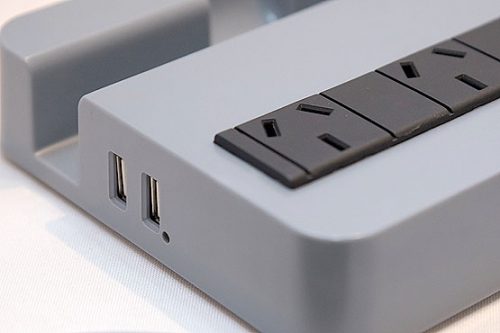 Protector de tensión con estación de carga USB