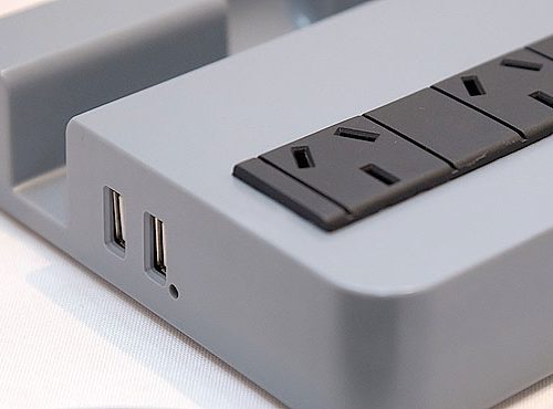 Protector de tensión con estación de carga USB